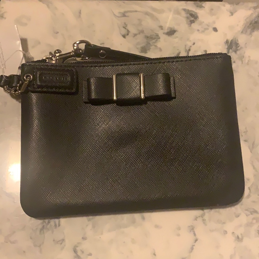 Black coach wristlet with a bow